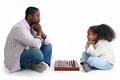 image playing chess - a good example of keeping the relationship between parents and children.