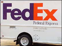 FedEx truck image. - Look at the white space between the E & x, you'll see the arrow.