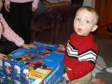 Son - My son opening a present on christmas. Boy dont he look suprised.
