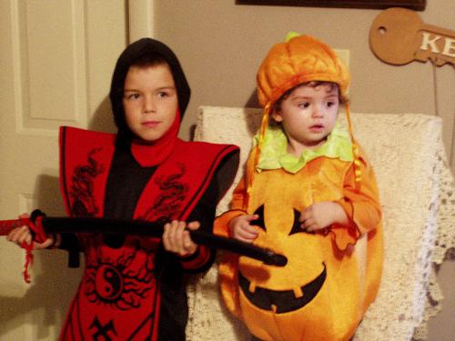 Thomas and Emma - Halloween 2006. Thomas and Emma just before going to Trick or Treat. Silly me, I bought Emma a pumpkin costume that was very hot. We live in Florida so it was very hot out. By the time we got home, she was dripping with sweat. Good thing I took off the costume half way home or she would have passed out from the heat. :)