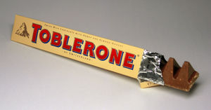 Toblerone Milk Chocolate - An unwrapped Toblerone milk chocolate candy bar