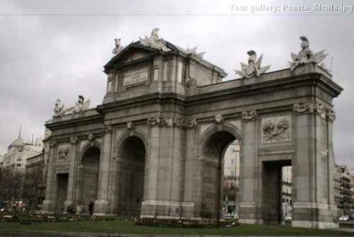 Puerta de Alcalá - Its a monument in Madrid, the capital of Spain...obligated to go visit if you go there on holidays. It's in one of the main streets of the city.