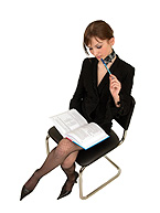 Working Women - Women working dedicatedly while sitting on a chair