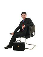 Working Executive - Working executive sitting on an office chair