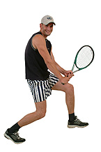 Sports - Man playing lawn tennis to keep him fit