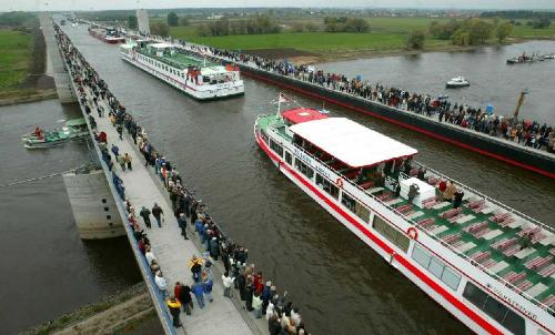 Water Bridge of Germany - 6 years , 500 million euros, 918 meters long........  This channel bridge joins the former east & west Germany over the river Elbe.It is located near the city Magdebug, near Berlin.  This photo is taken on the inauguration day....