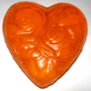 peach soap - i made this soap and am going to use it as party favors at my upcoming wedding. the soap is peach scented. i am also going to use apple scent with green color and lavender scent with purple color. i like the heart shape with pretty floral design on it