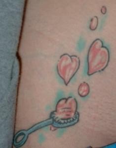 My Hip Tattoo - A bubble wand with heart shaped bubbles tattooed on my right hip.