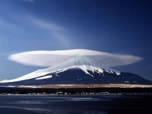 heaven touching earth - and heaven is just an arm's length away. this picture is so serene that you can actually feel the stillness of it. as if you would want to spend a quiet contemplate on top of the mountain and pray, and know that your prayers are clearly heard.