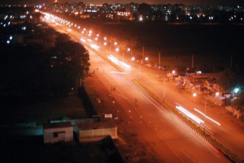 Night Shot of Road in Surat - This is night shot taken by me from building of a Udhna-Magdalla road in Surat, Gujarat in India. The City was stuck with 'Plague' and then went on to become the most clean City of India.