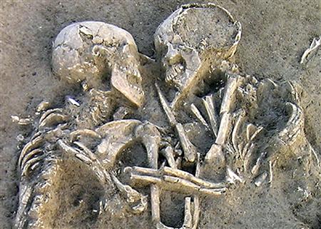The longest hug in history? - A pair of human skeletons lie entwined at a Neolithic archaelogical dig site near Mantova, Italy, in a photo released on 6th February 2007.