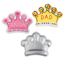 Wilton Crown Pan - 2105-1015   Treat your little princess (or prince) like royalty at their next celebration! This majestic crown cake is a fun way to honor both kids and adults alike–perfect for birthdays, school parties, Mother’s and Father’s Day, more!   One-mix pan is 14 1/4 x 10 1/2 x 2 in. deep. Aluminum.