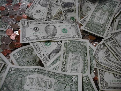 Lot of coins - A table full of money.