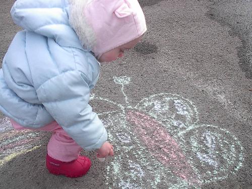 kid colouring - my daughter colouring the pavement with chalk.