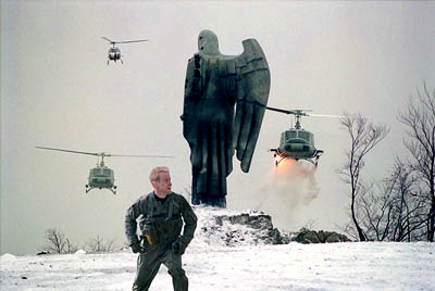 Behind enemy Lines  - American troops arrive to rescue owen wilson . As owen wilson is coming back to take the cd in which he has taken the photo