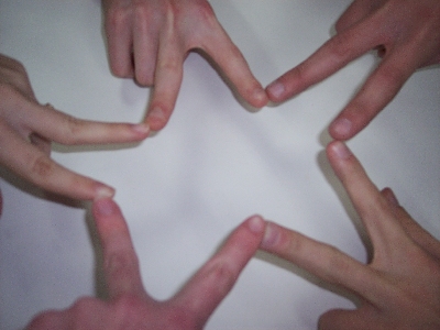 fingers in a star - my friends and I did this at dairy queen. I think it's so cute!
