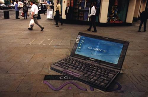 Street image in 3D - Here is an a English artist makes 3D picture on the road. The art is real and fascinating. But the question is waste of time and energy. Can it gives any satisfaction to him?