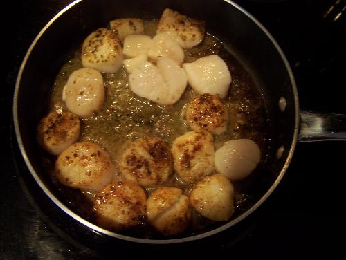 Cooking - Cooking scallops with butter, herbs, & lemon zest.