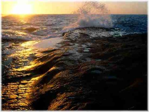 Sunrise on the ocean - The water looks dirty brown but it was only the darkness of night as the sun was coming up