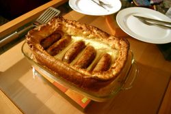 Toad in the hole - A traditional British dish, with sausages in Yorkshire pudding.