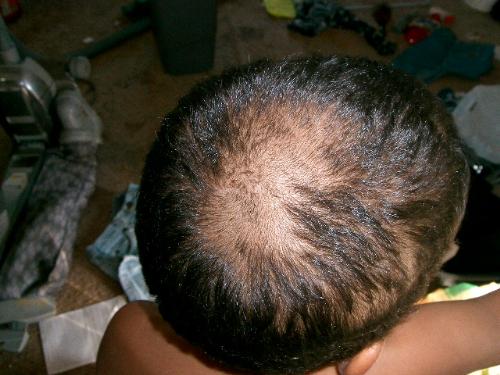 My son's haircut - This is what happens when a 4 yr old finds scissors and decides that he wants to cut his hair like Daddy... especially when his daddy shaves his head.