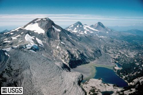 Three sister volcanoes - This is the Aerial view of the three sisters volcanoes in Oregon. From left to right are the South sister, Middle sister, and North sister. They are three dormant volcanoes. It's cute to see that the volcanic mountains also share a sisterly bond.