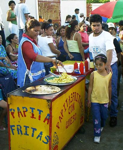 A street vendor selling French Fries in Nicaragua - This is a photo of a street vendor selling french fries in Nicaragua