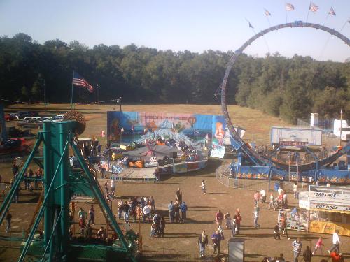 Carnival  - From birds eye view me over looking the carnival while riding the ferris wheel.