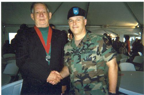 dad receiving medal for war service - dad standing next to ft.dix commander shaking hands