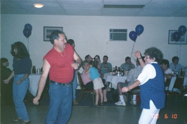 Two People Dancing at a Party - This is a photo of my father and his sister dancing at a party.