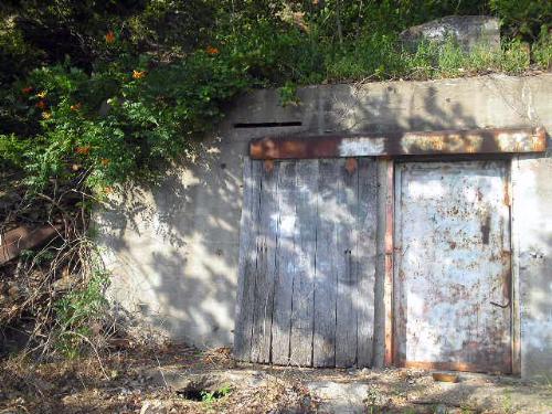 Doorway to Hell - In Little Rock, there is a place we have dubbed 'The Road to Nowhere', which is the ruins of both a settlement from the late 1800's and early 1900's as well as an old mining operation from the 1920's.   This is one of the bunker type buildings that the city has since welded shut that I have come to know as 'The Doorway to Hell'.