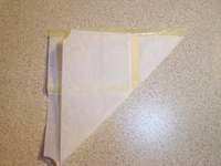 Fold rolling paper - Fold the paper diagonally but leave the gum side exposed. You'll need to fold the edges of the paper and make a seal