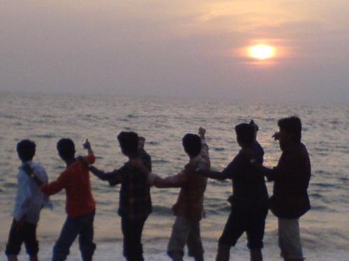 Sunset...My Friends... The Sun will rise again - Me with my friends at shanku-mukham beach,  TVM, Kerala, India...   Sun about to set beyond the horizon