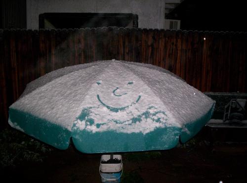 Snow Smiling At Us - This is a picture I took a few weeks ago at the beginning of February when It actually snowed here. I live in the heart of Tucson and we don't usually get snow, sothis was a big deal for us. My daughter just loved it. I have lived here 37 years and I havae only seen snow in the heart of town 4 times. What fun.