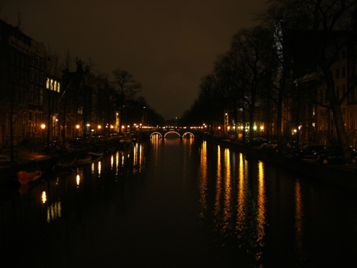 Amsterdam Canal Lit Up at Night - This long-exposure shot is an effort to capture the serene beauty of the canals at night.