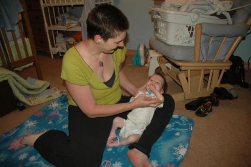 Sign Language - here i am with my son Louie Jr practicing sign language. He is not deaf but due to his tracheostomy his language abilities are seriously delayed. We started basic sign language with him to improve his communication. It also acts as a kind of physical therapy for him since he has to stretch and move to make the signs. In this photo i am supporting his elbow so he can sign 'mama'