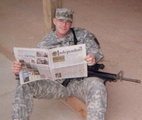 the hubby - reading home paper when in iraq