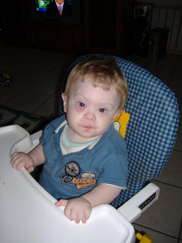 Eating dinner - Ben eating his meal in his ighchair for the first time.