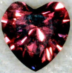 why you love someone???? - this is a heart shaped RED DIAMOND. it is natural, fancy,intense,purplish n red. it costs $149,108 per carat...
