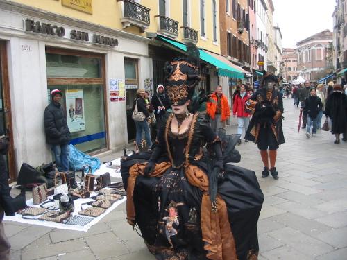 Costumed for Venice's Carnivale - Carnivale in Venice Italy is a festive and fun time of year. There are beautiful costumes and masks everywhere you look.