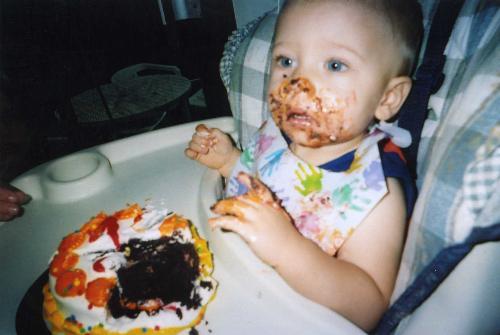 1st birthday - This is a picture of my son on his first birthday... and first cake! T first he was afraid of it, but once he got taste, he couldn't stop.