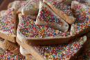 Fairy Bread - This is a party favourite, particularly with this age group.  To make Fairy Bread all you need is:  1 loaf white bread 1 packet 100s & 1000s Butter, Maragrine or Nutella (or any other chocolate bread spread  Spread butter on bread, sprinkle with 100's and 100's and enjoy. You can cut the crusts off, and slices into triangles or squares or even use cookie cutters to create fun shapes in your bread. Sprinkles can be rainbow colours or you can use individual colours to make the perfect fairy bread.