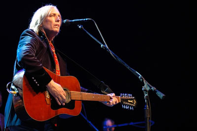 petty - tom petty playing on his electric guitar, live.