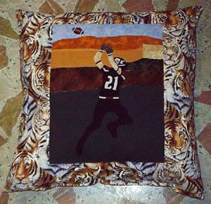 My son. - A pillow I made from a picture of my son playing football.