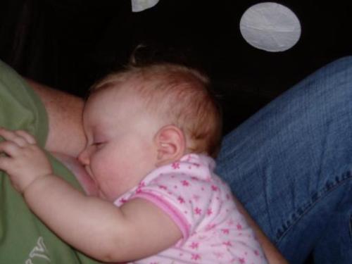 breastfeeding - A mother breastfeeding her baby