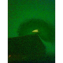 Aliens - This photo was taken with night vision. That's why it is green. There was this triangle shaped object floating over the bank.