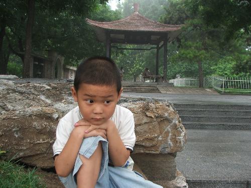 my young son - taken by 8,2006 in beijing TAONAN park.  does he like the scenic in the park?