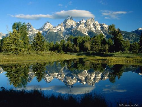 Lake - A very beautiful Lake with mountains around ,trees and green fields.