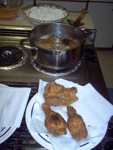 fried chicken! - this is the whole set-up for fried chicken -- the egg with hot sauce, self-rising flour, chicken pieces, hot peanut oil and even some cooked chicken for snacking! enjoy!