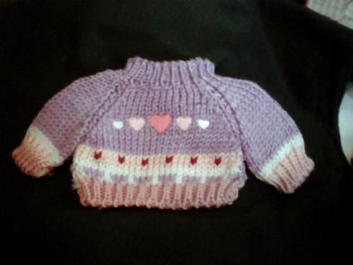 Dog Sweaters - Here is an example of the type of sweaters I sell. They are really made for teddy bears and dolls but fit small dogs really good. Gizmo has a ton of them..hehe
